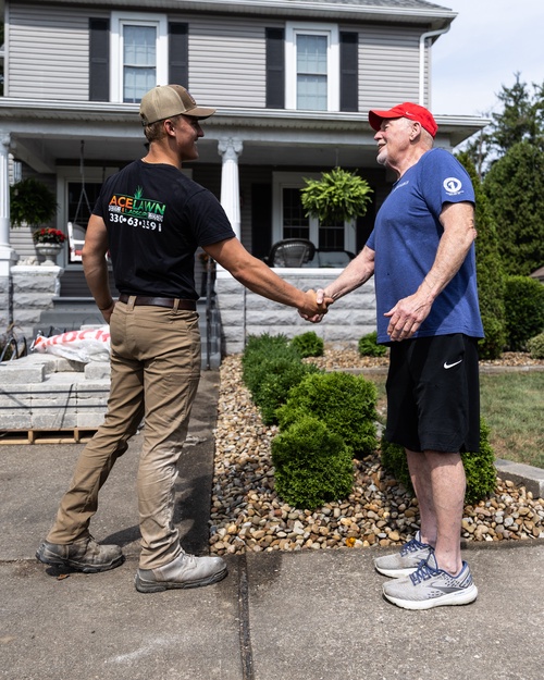 Jagger Morrison shaking hands with a satisfied customer