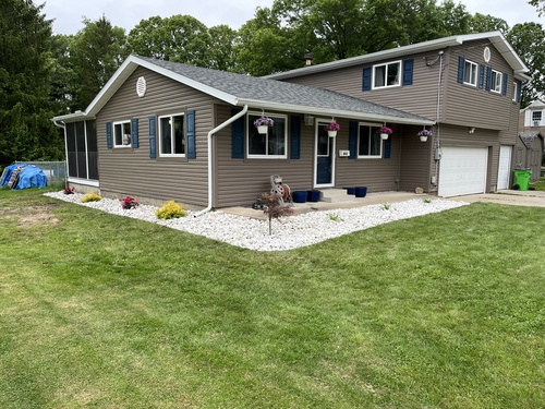 Freshly maintained landscape beds along the front of a Dennison, Ohio home